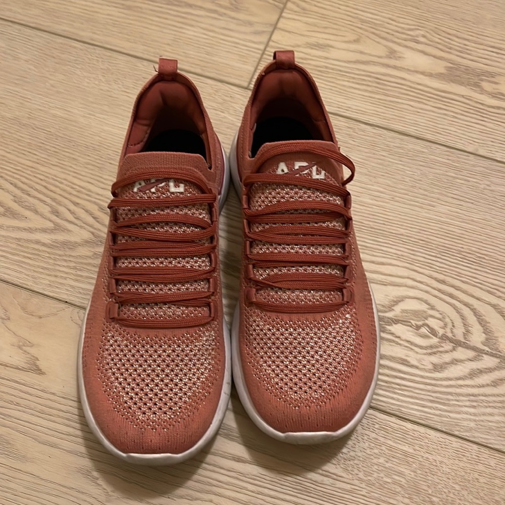 Pink APL tennis shoes